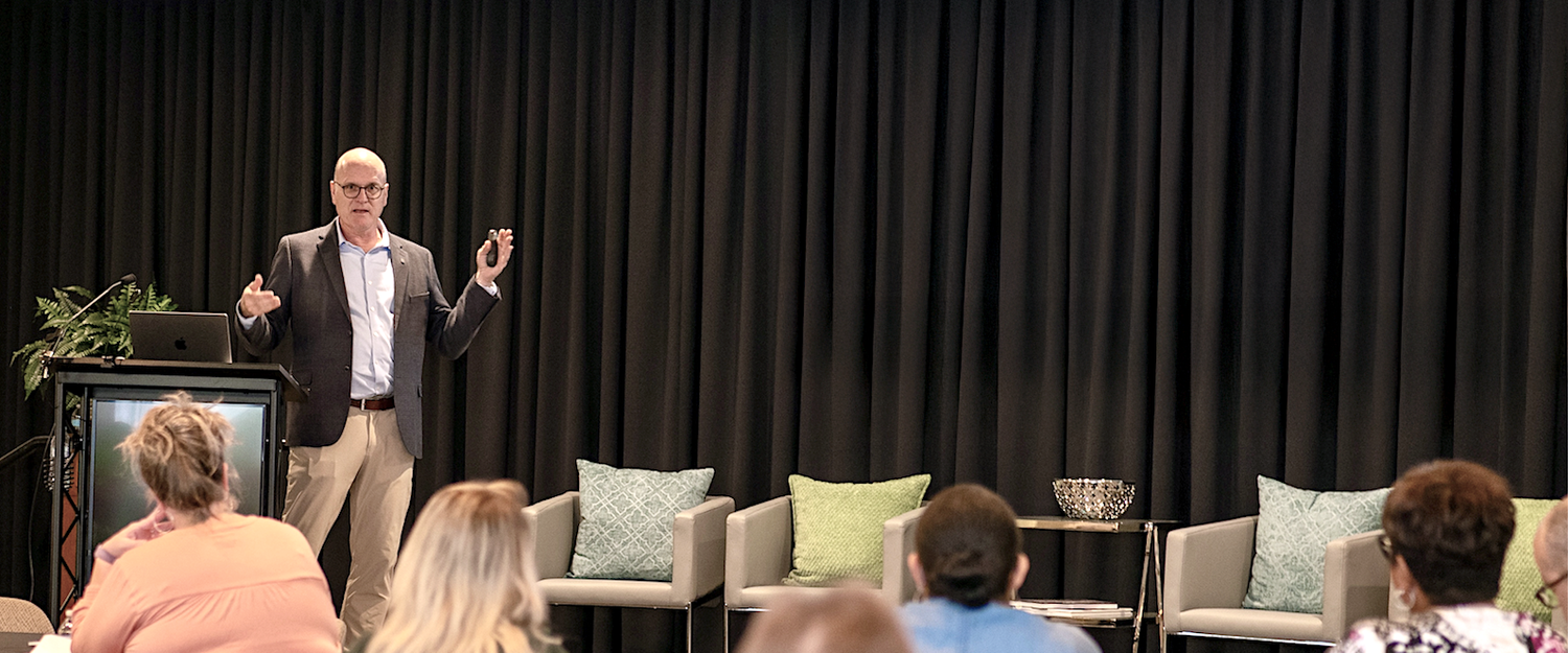 Carlton Davis delivering a presentation on AI to an audience of small business owners